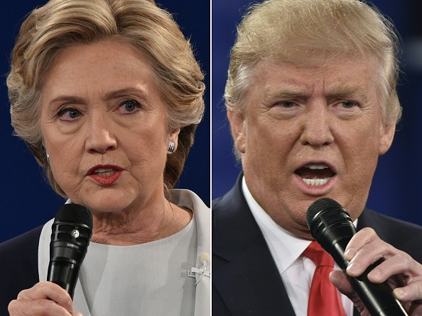 (COMBO) This combination of pictures created on October 09, 2016 shows Democratic presidential candidate Hillary Clinton and Republican presidential candidate Donald Trump during the second presidential debate at Washington University in St. Louis, Missouri on October 9, 2016. / AFP / Paul J. Richards (Photo credit should read PAUL J. RICHARDS/AFP/Getty Images)